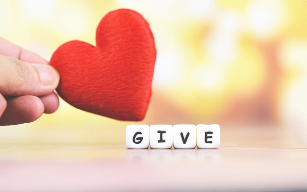 a heart over boggle tiles reading "Give"